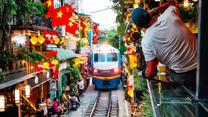 Hanoi Train Street with Vietnamese flags